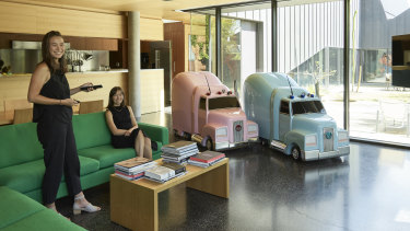 Carlin (left) and Jaqlin Lyon in the Housemuseum living area, with Piccinini’s Truck Babies, 1999. 