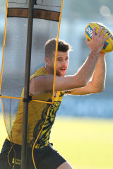 Trent Cotchin takes part in a drill.