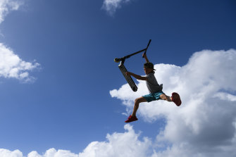 A child scootering at Maroubra skate park on Saturday. 