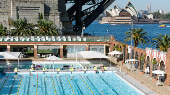 The harbourside pool is surrounded by the Sydney Harbour Bridge, Opera House and Luna Park. 