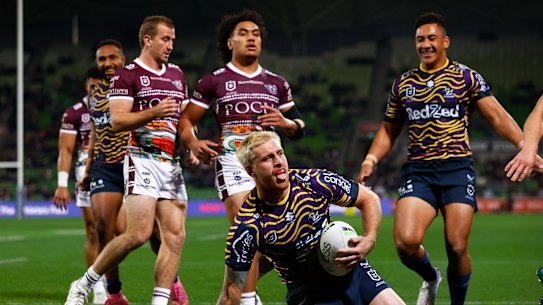 Melbourne’s Cameron Munster celebrates after scoring a try against Manly.