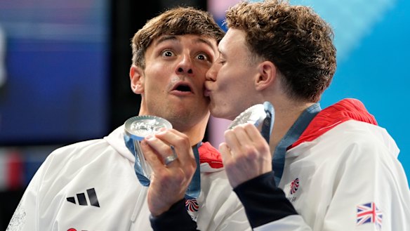 Britain’s Tom Daley, left, and Noah Williams celebrate on the podium after winning the silver medal in the men’s synchronised 10m platform diving final.