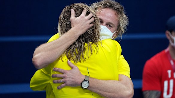 Dean Boxall and Ariarne Titmus hug it out.