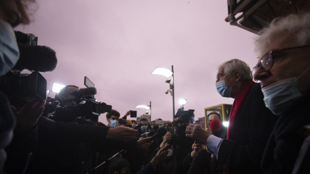 Lawyers George Henri Beauthier, second right, and William Bourdon, right, representing the National Council of Resistance of Iran, speak with the media as they arrive at the courthouse in Antwerp, Belgium.