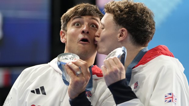 Britain’s Tom Daley, left, and Noah Williams celebrate on the podium after winning the silver medal in the men’s synchronised 10m platform diving final.