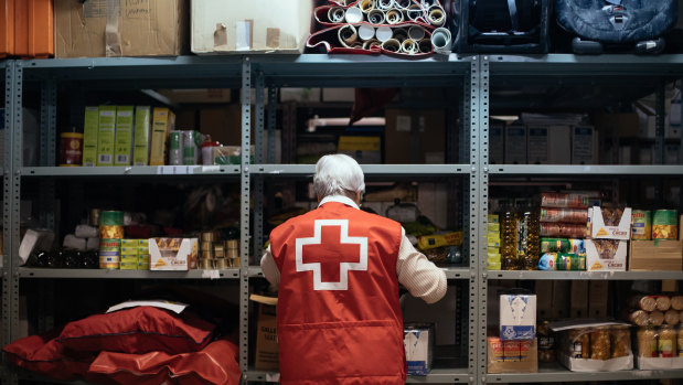 A Spanish Red cross volunteer works at a food bank helping people affected by the Covid-19 crisis in Huesca, Spain.