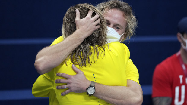 Dean Boxall and Ariarne Titmus hug it out.