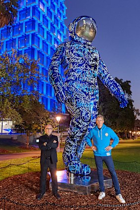Gullotti Galleries owner Paul Gullotti and artist Brendan Murphy with the BOONJI Spaceman installation at Perth’s Council House.