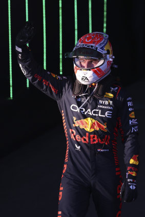 A victorious Verstappen celebrates his win.