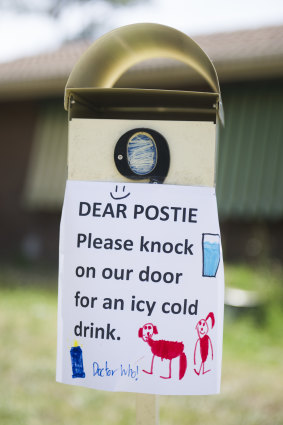 The Langford family have a sign on their letter box so posties know they can knock on the door to cool down.