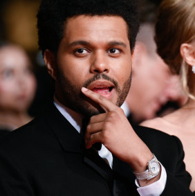 Canadian singer The Weeknd with his diamond-encrusted “ladies’” Piaget watch at Cannes.