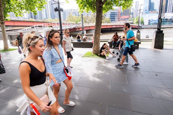 People enjoying a walk along the Yarra River on Monday.