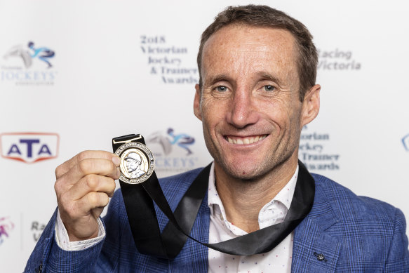 Damien Oliver, pictured with the 2018 Scobie Breasley Medal, his ninth. 