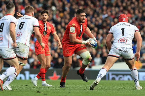 Meafou charges with the ball for Toulouse.