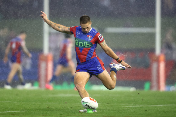 Kalyn Ponga kicking a goal.