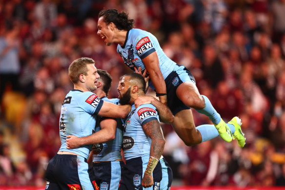 The Blues backline celebrate during game two at Suncorp Stadium.