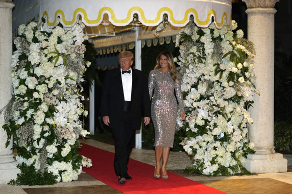 Former US president Donald Trump and former first lady Melania Trump arrive for a New Year’s Eve party at Mar-a-Lago, in Palm Beach.