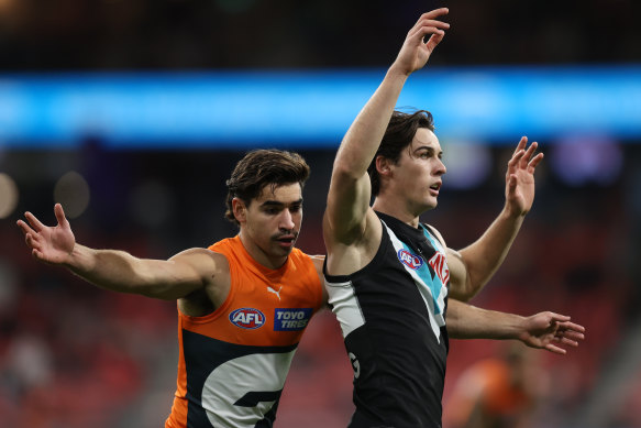 GWS’ Toby Bedford and Port’s Connor Rozee compete.