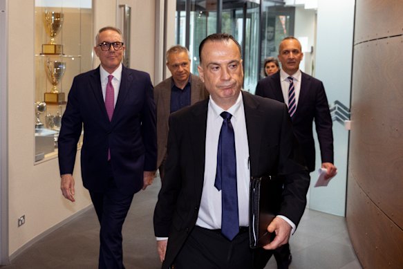 Australian Rugby League Commission chairman Peter V’Landys leads (from left), Foxtel chief executive Patrick Delany, Nine boss Matt Stanton and outgoing NRL chief Andrew Abdo into a press conference.