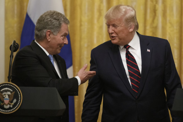 Finnish President Sauli Niinisto shares the stage with Trump.