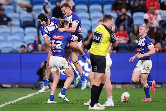 Jacob Preston and the Bulldogs celebrate a try on Saturday night.