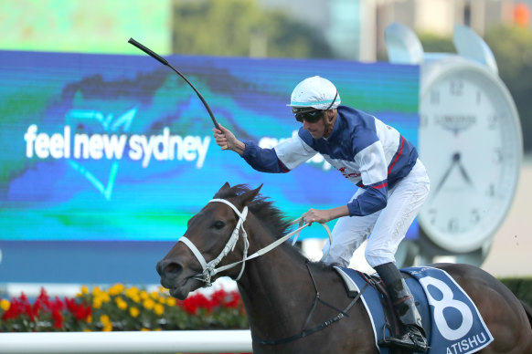 Nash Rawiller has time for a salute about Atishu in the Queen of the Turf. 