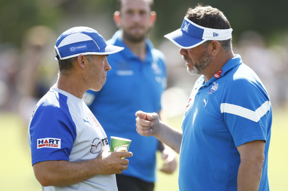 Kangaroos head coach Alastair Clarkson (left) chats with Kangaroos assistant coach Brett Ratten in February.