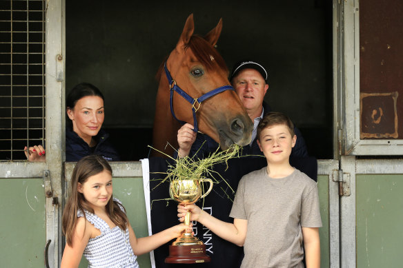 Trainer Danny O’Brien and his family - wife Nina and kids Grace and Thomas - pose with the good-natured Vow And Declare after his Melbourne Cup win in 2019.