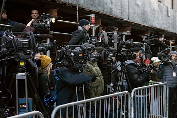 Members of the press wait for Manhattan District Attorney Alvin Bragg.