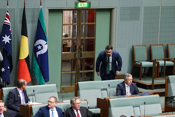 Opposition defence industry and defence personnel spokesman Phillip Thompson leaves after being suspended from the House of Representatives during question time.