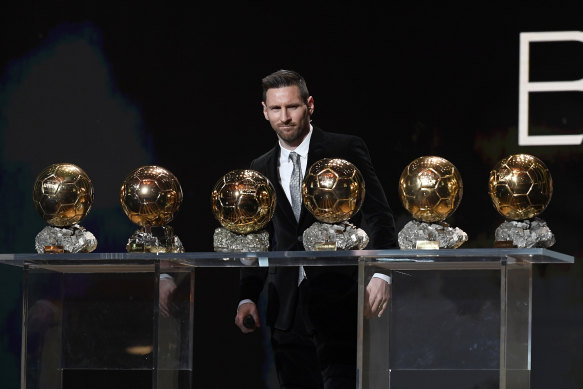 World's best: Lionel Messi poses onstage after winning his sixth Ballon d'Or last year.