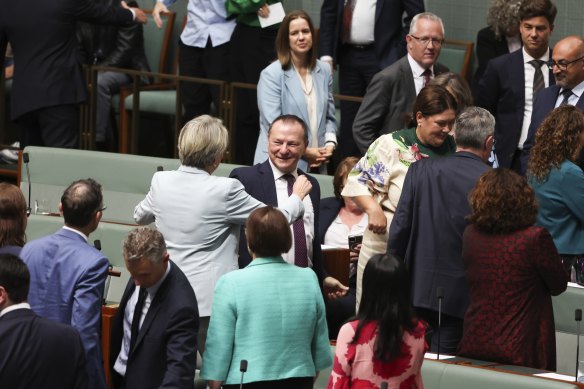 Labor MP Graham Perrett (centre) is congratulated by colleagues after delivering his valedictory speech.
