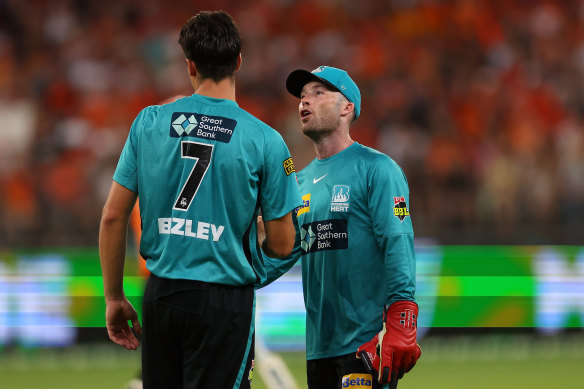 Heat skipper Jimmy Peirson, right, with James Bazley during the Big Bash League final defeate against the Perth Scorchers on Saturday. 