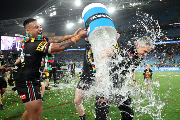 Spencer Leniu pours an ice bucket over Panthers coach Ivan Cleary after their grand final win.