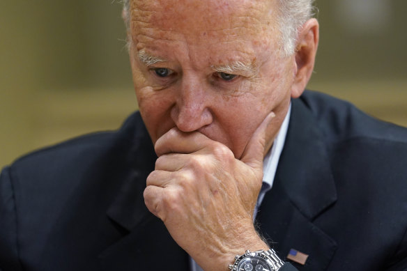 President Joe Biden listens during a briefing with first responders in Miami on Thursday.
