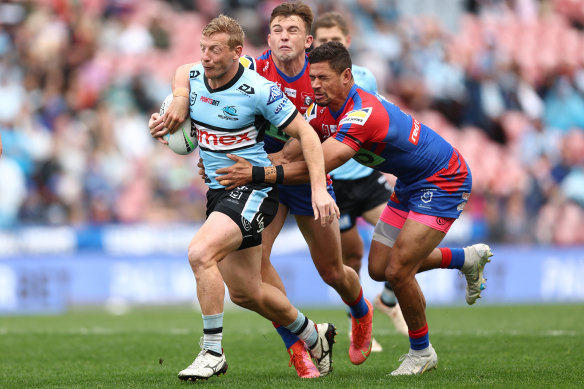 Lachie Miller tries to escape the Knights’ defence.