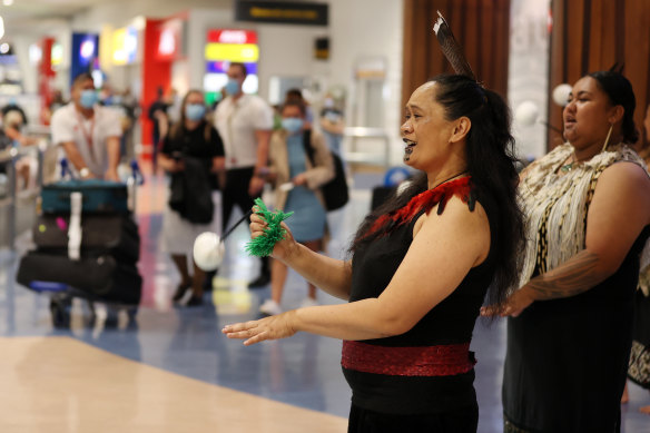 A Maori cultural group welcomes Australian tourists into Auckland after borders were reopened in April.