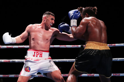 Christian Tsoye (right) defends himself as Justis Huni lets fly on Wednesday.