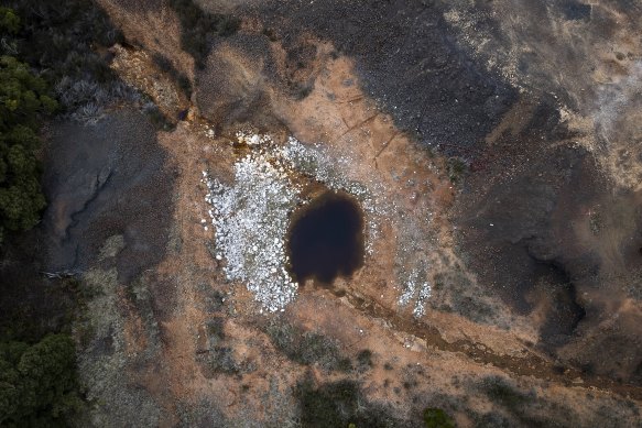 Toxic water runs from an abandoned mine shaft into nearby Daylight Creek at Sunny Corner, near Bathurst.