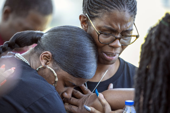 Mourners gather for a remembrance service at Immerse Church of Ocala for Ajike Owens in Ocala, Florida.