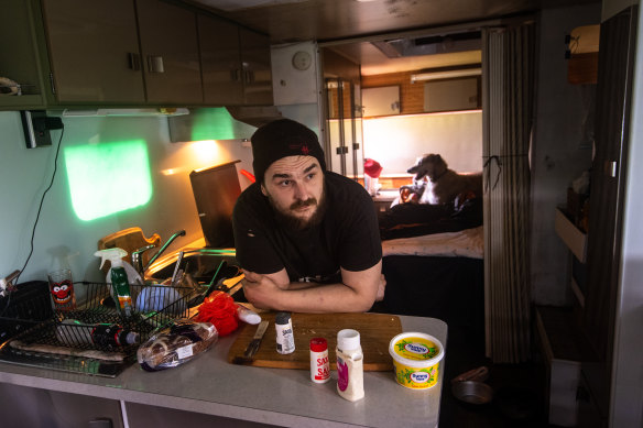 Leanne Gray’s son, Jake, in their caravan with dog Tiggy.