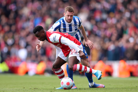 Arsenal’s Eddie Nketiah tussles with Adam Webster during the Gunners’ loss to Brighton.