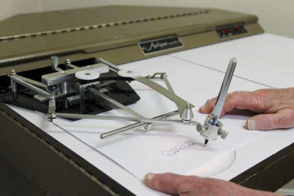 An automatic signing machine, known colloquially as an autopen.