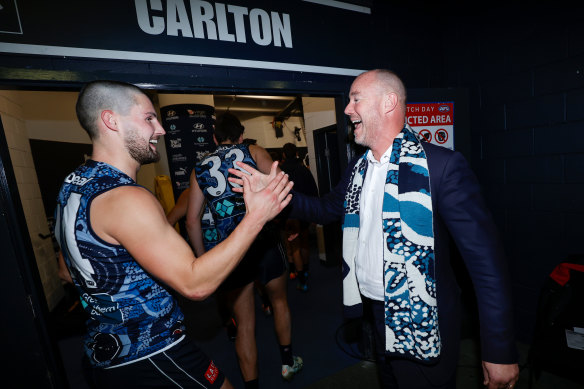 Blues president Luke Sayers celebrates a win with Nic Newman in 2022.