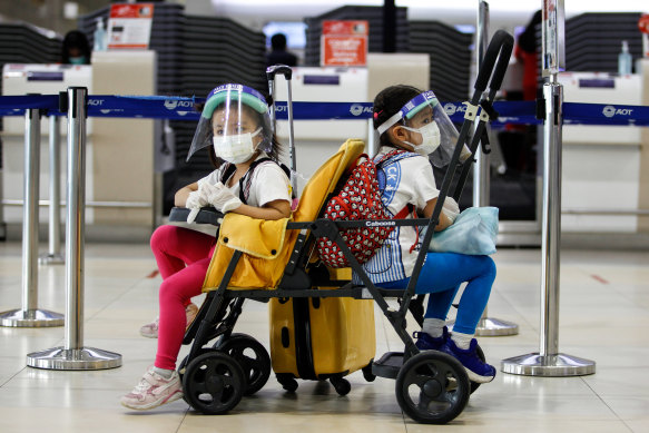 Kids wearing face masks as a preventive measure against COVID in Bangkok