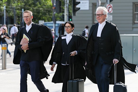 Barristers for Coles, Andrew Barraclough, Sahrah Hogan and John Sheahan, KC, outside court on Monday.