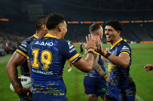 Morgan Harper celebrates scoring while Latrell Mitchell is in the sin bin.