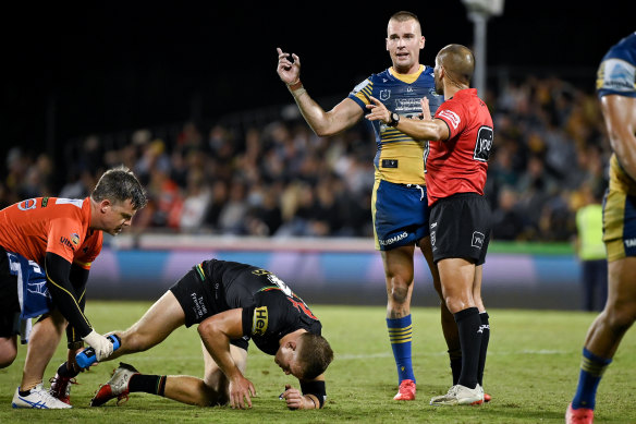 Peter Green attends to Mitch Kenny last weekend while Eels captain Clint Gutherson questions the stoppage.