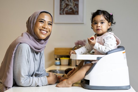 Sandra Annisa feeds her 18-month-old daughter Zyra fruit for breakfast at her home in Mill Park.