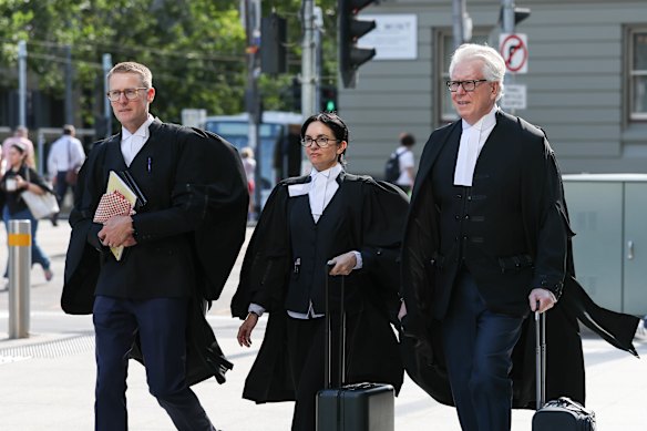 Coles’ team of barristers, led by John Sheahan KC (right), with Sahrah Hogan and Andrew Barraclough, walking into Federal Court in Melbourne on Monday for the opening hearing. 